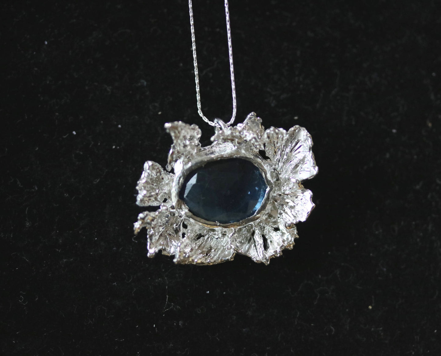 snowflake necklace with blue stone