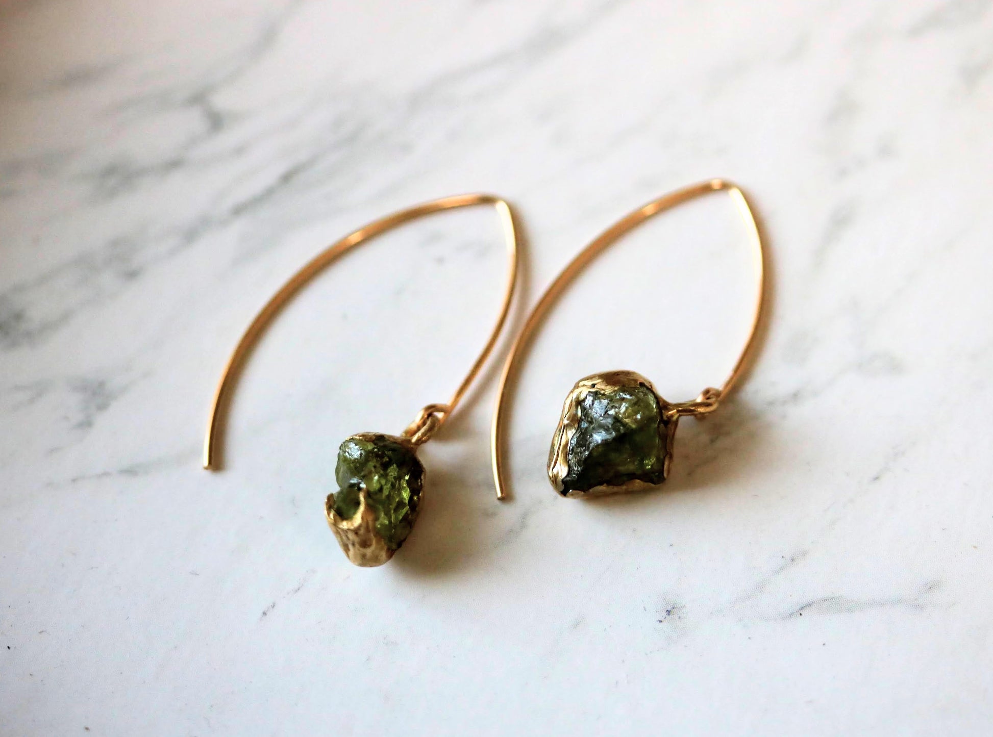 gold hook earrings with raw peridot