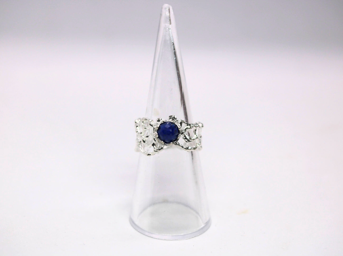 ring with round blue stone 