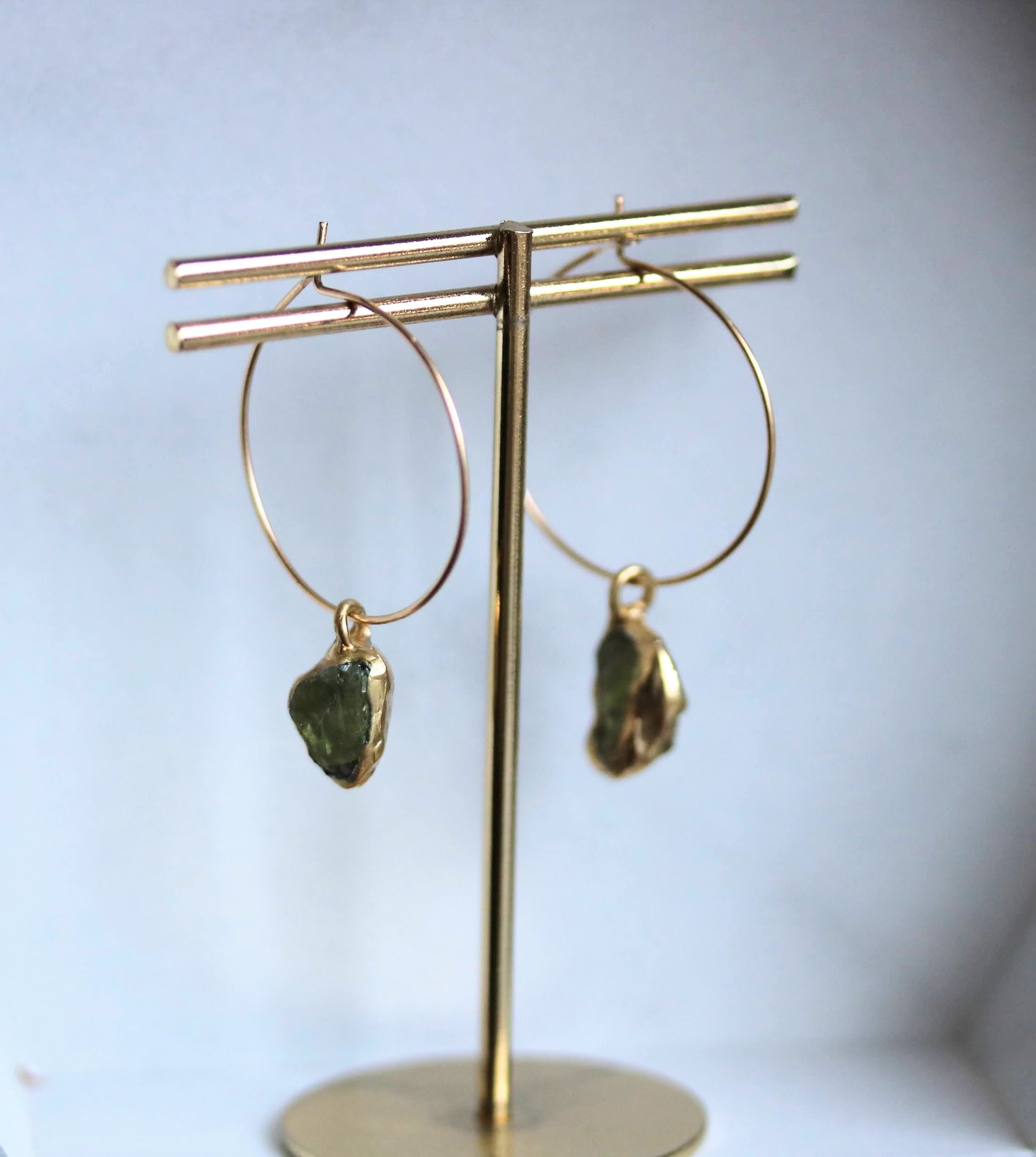 gold hoops with raw peridot 