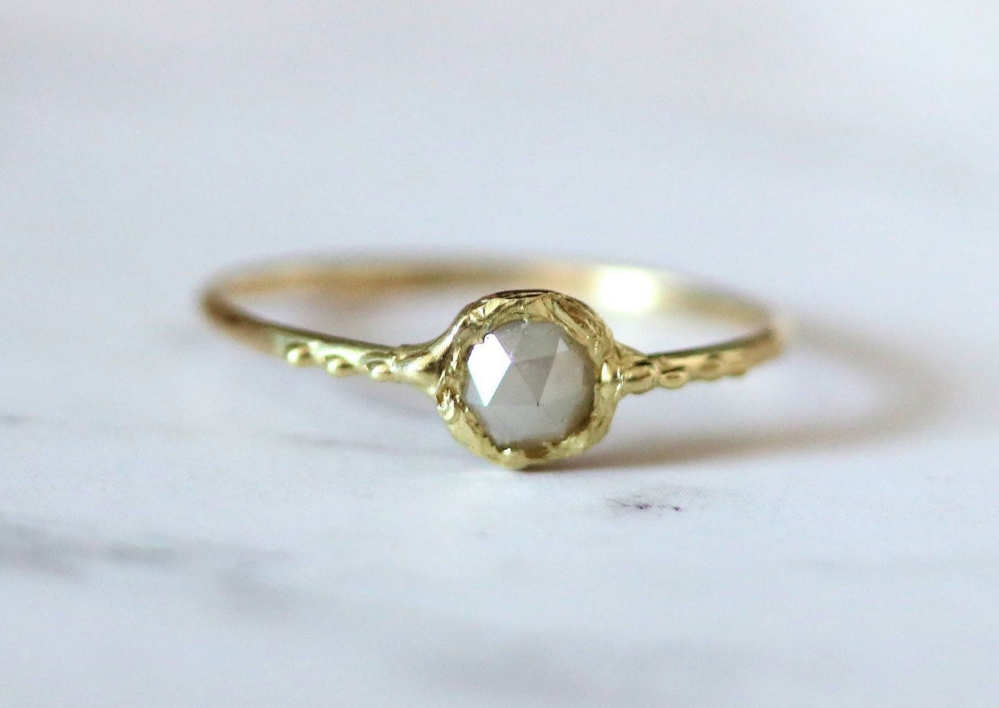 stacking gold ring with gray diamond