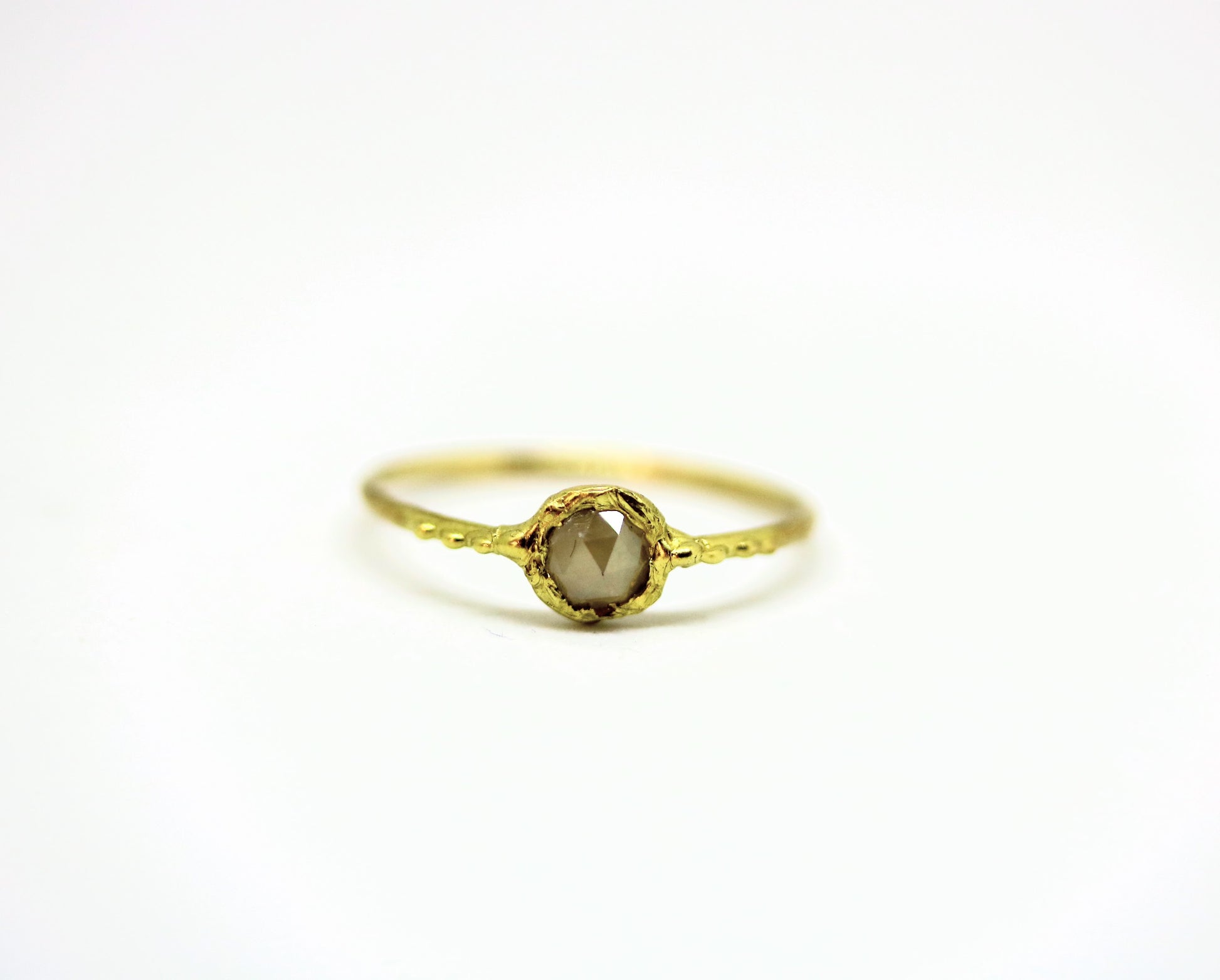 thin gold ring with small diamond