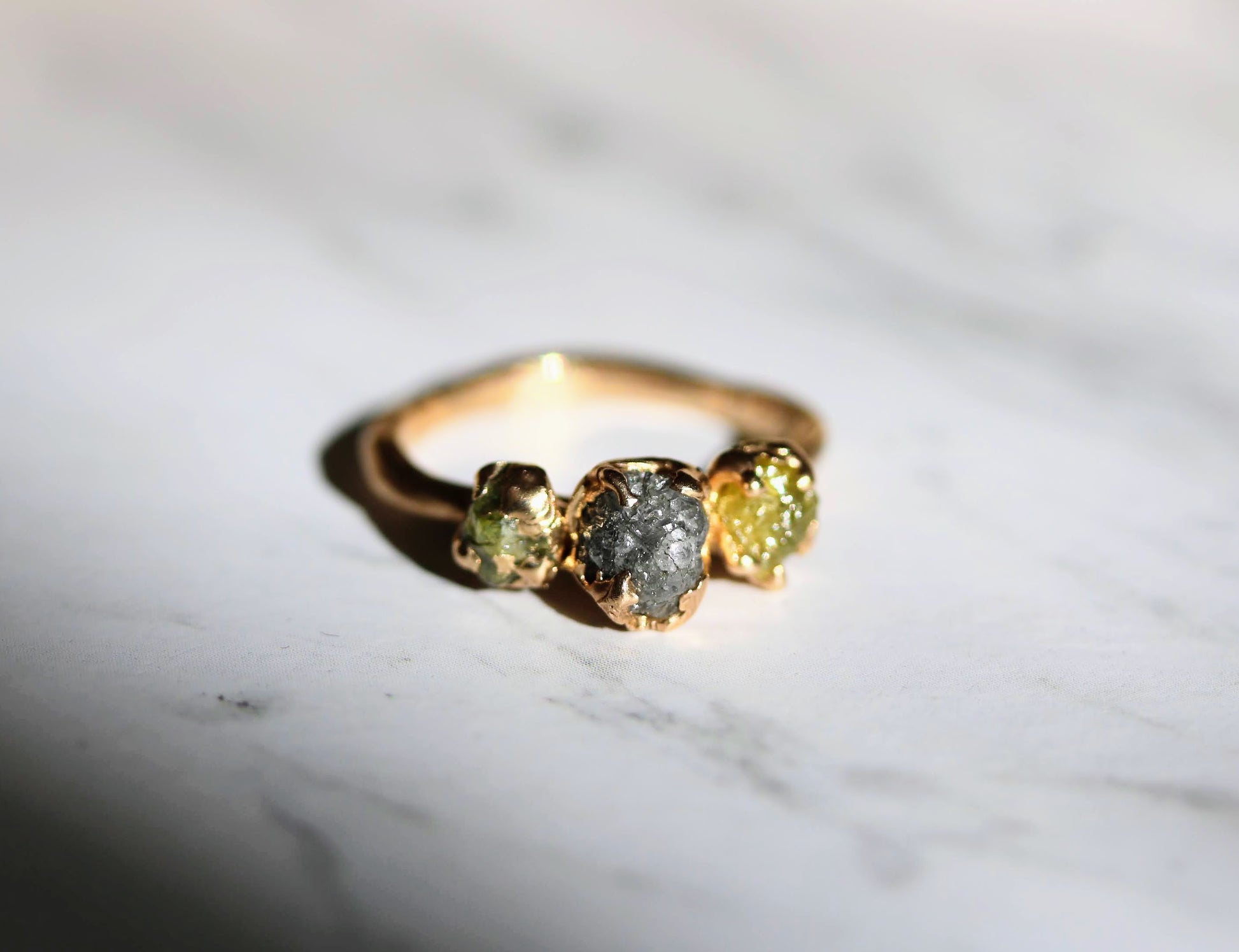 three raw colored diamond engagement ring