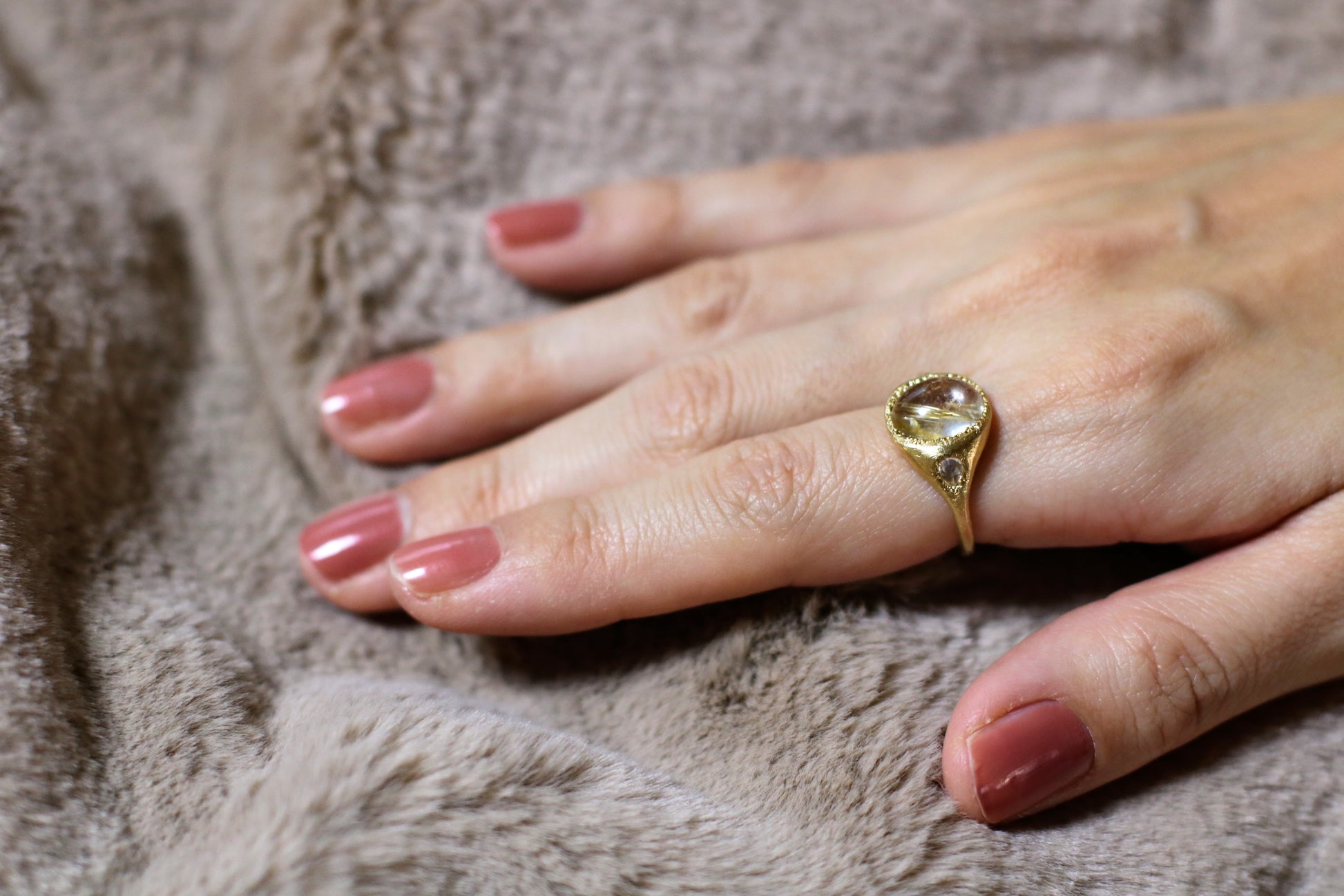 gold rutile quartz ring with moonstone accent