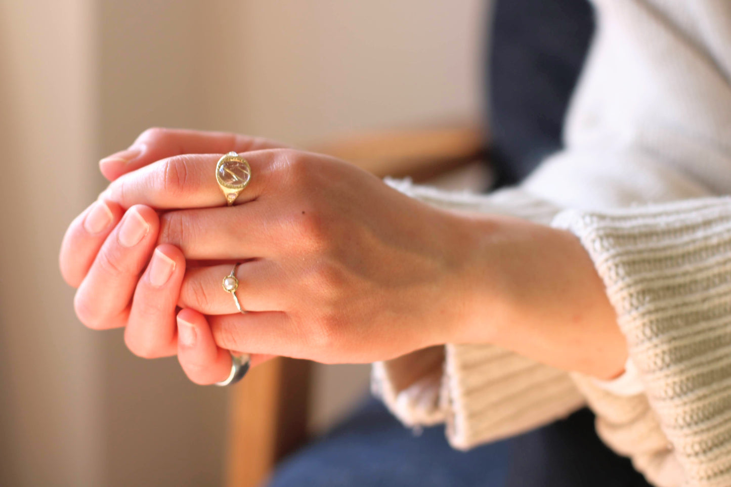 gold rutile ring with rainbow moonstones