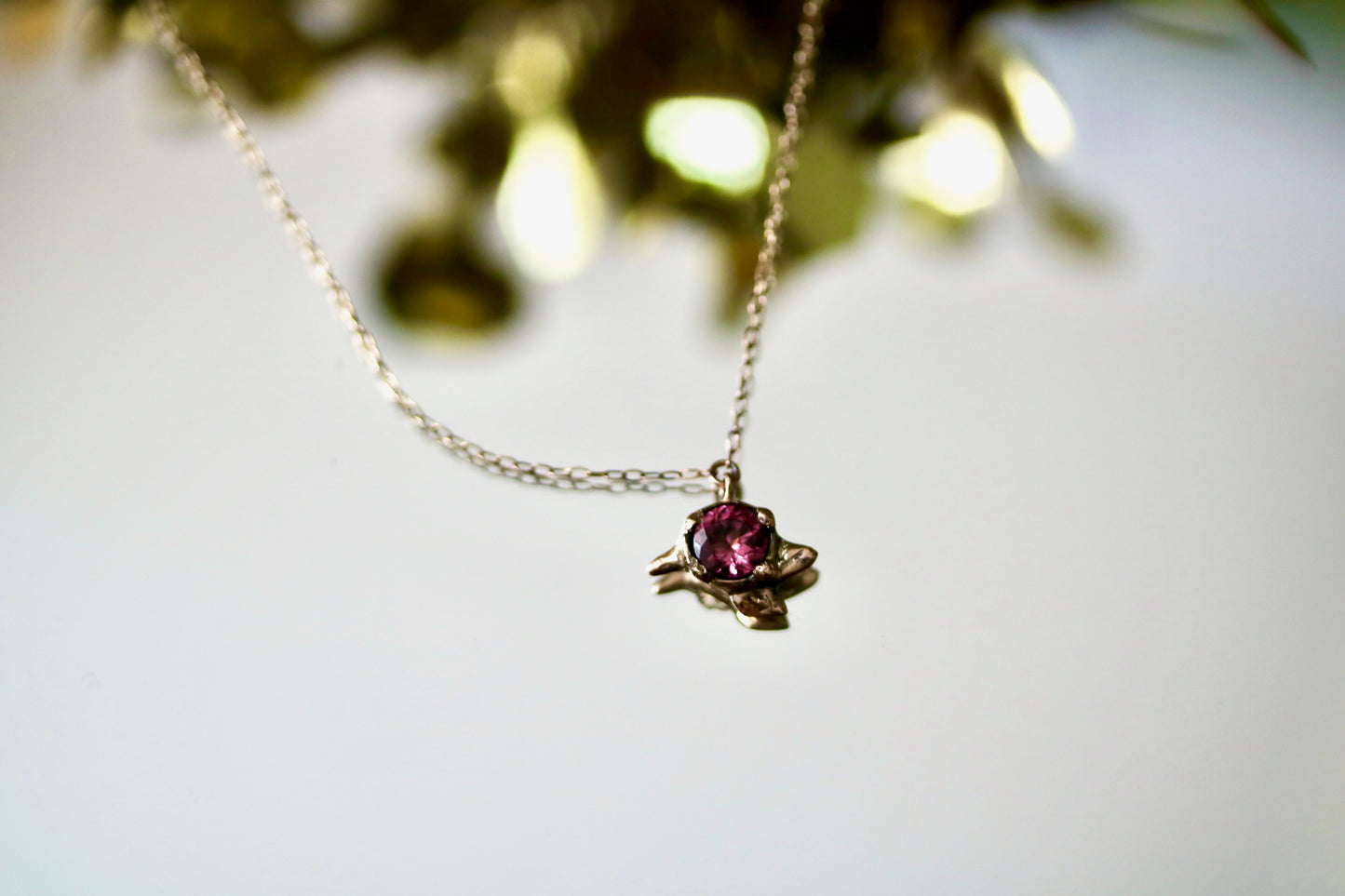 gold necklace with pink garnet