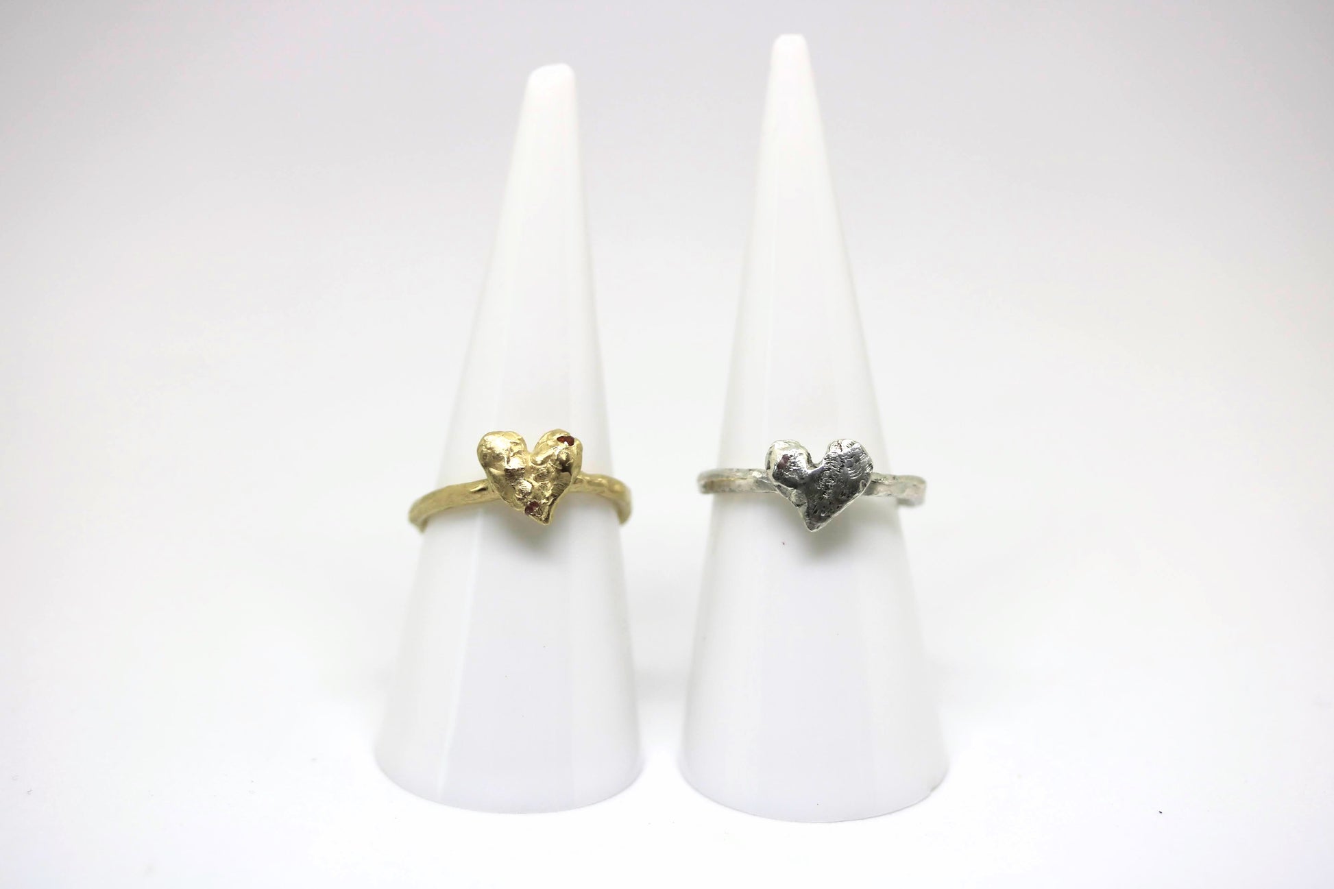 yellow gold heart ring and silver heart ring