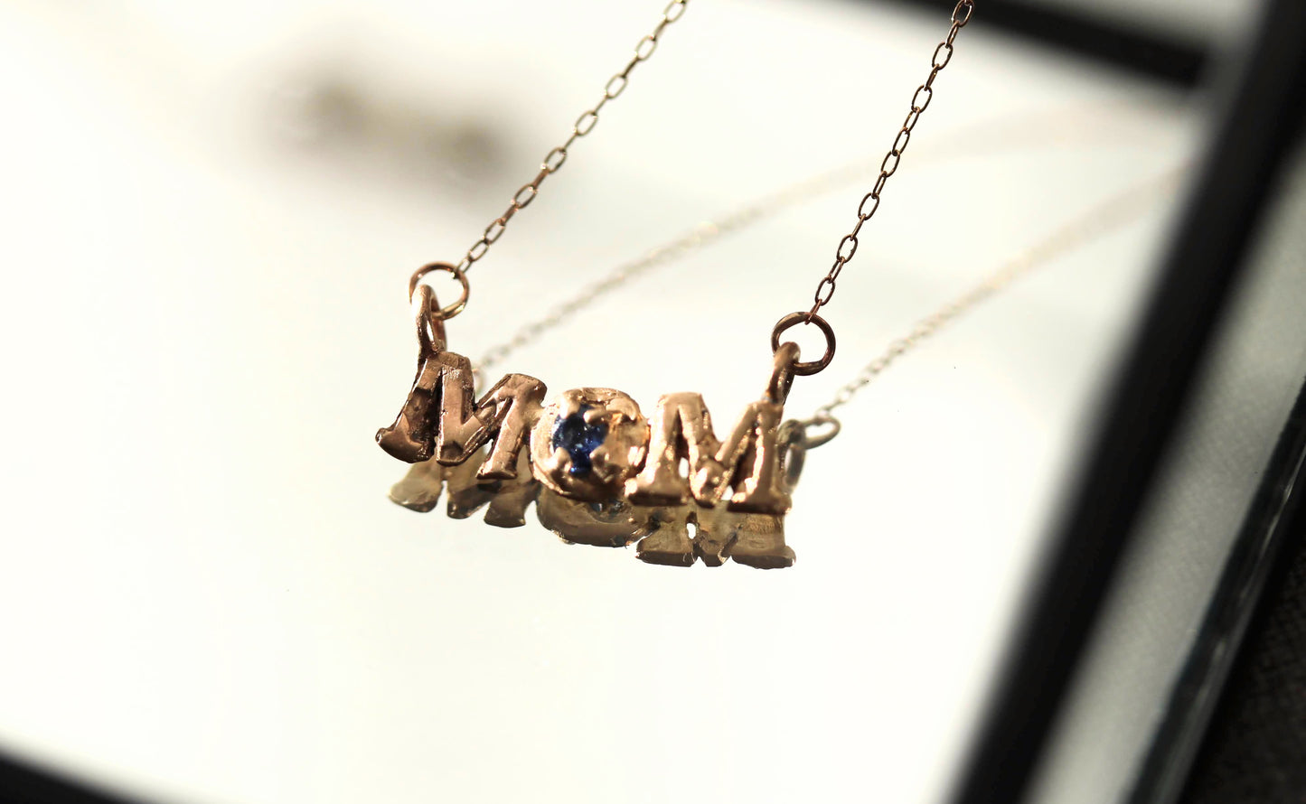 gold mom necklace with sapphire