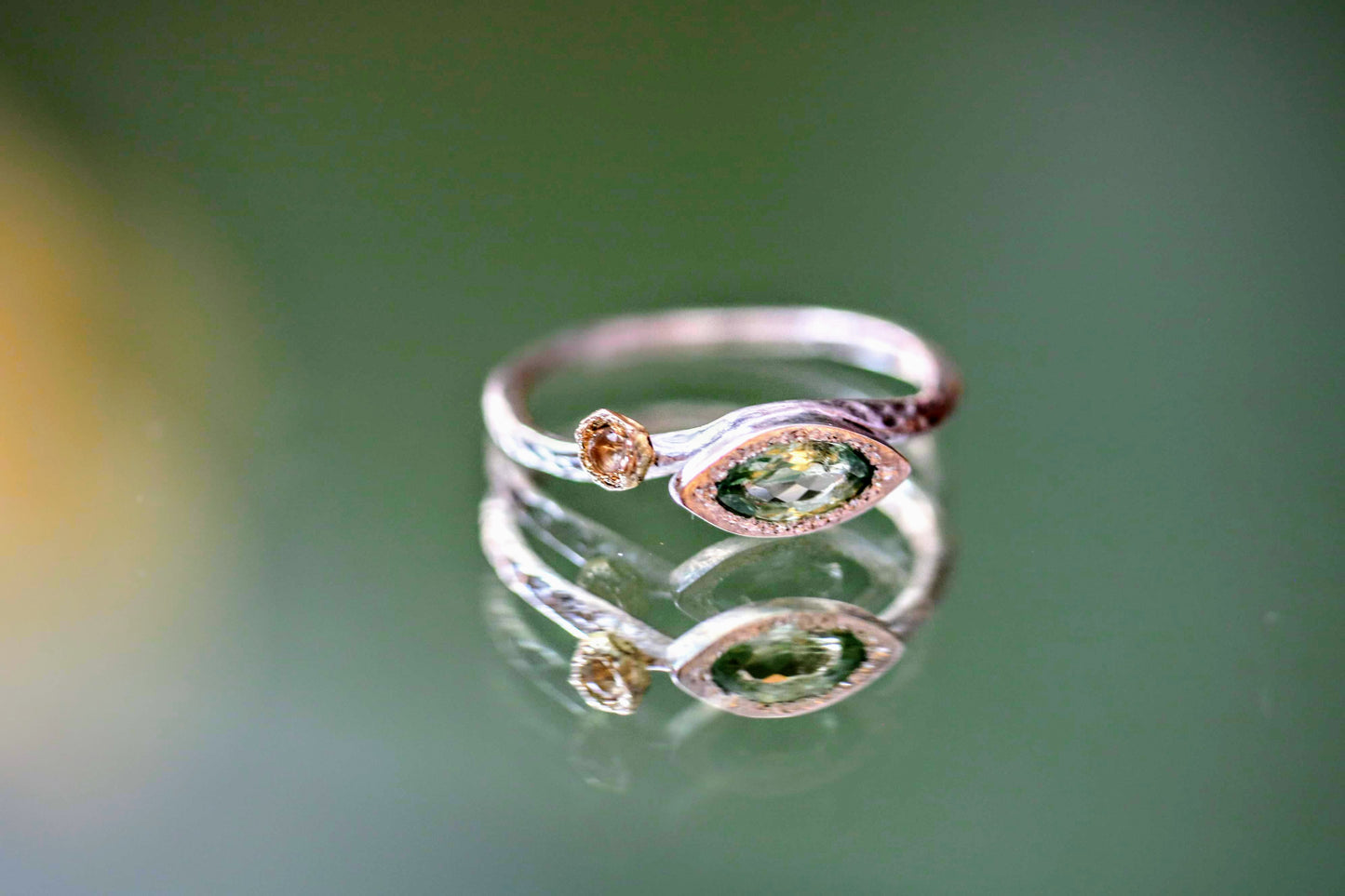 light green tourmaline marquise ring in silver and moonstone with 18k yellow gold