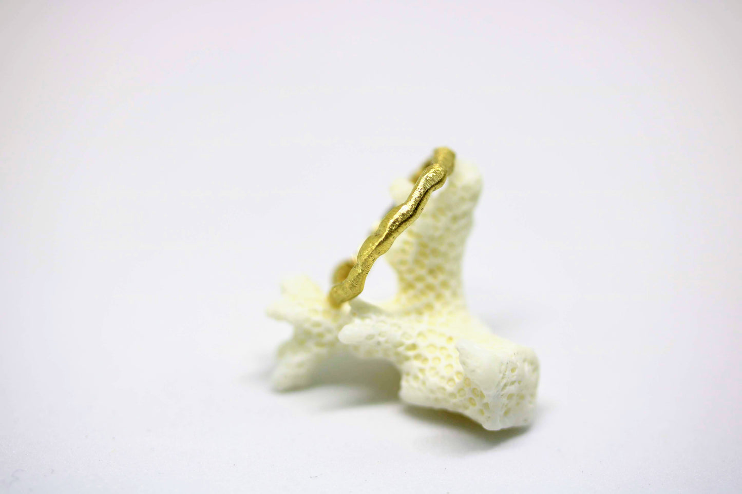 golden woven like textured ring